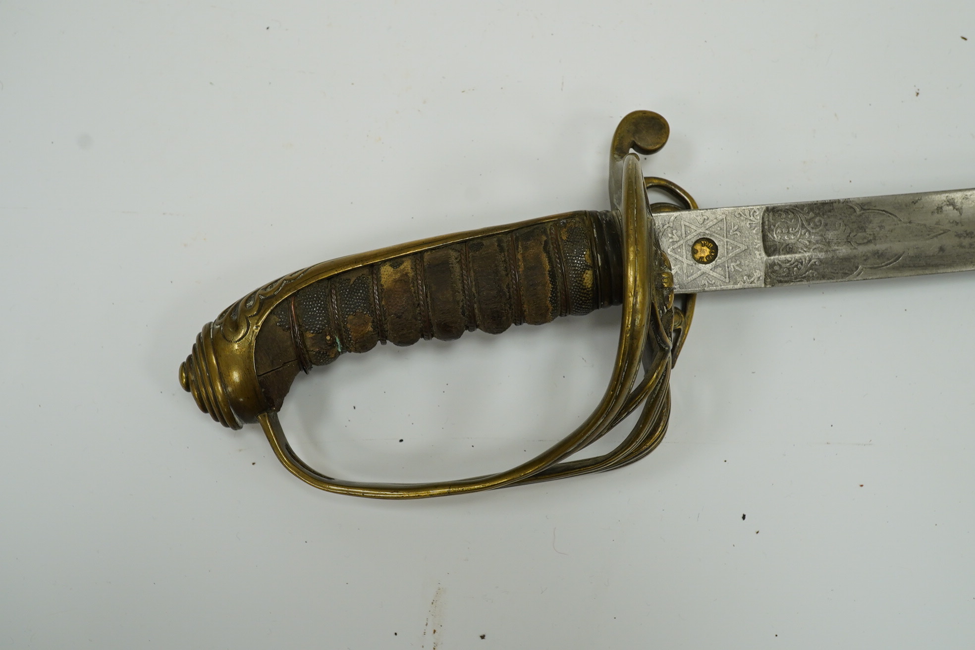 A Victorian 1845 pattern infantry officer’s sword, with regulation blade and brass hilt with folding side guard. Condition - fair, well worn over all.